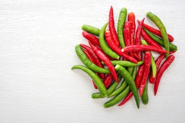 spur chilli, spur chili pepper, spur pepper, long green and red pepper on white background