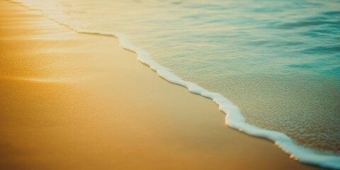 Sandy beach with sea waves blurred background; summer vacation in the natural beauty of a tropical paradise