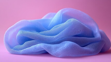 Soft blue mesh washcloth elegantly arranged on a vibrant violet background showcasing texture and color contrast for home or spa decor.