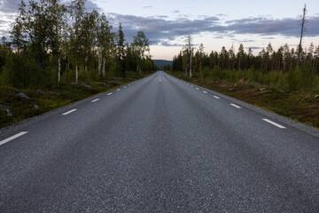 Fototapeta premium Empty road with a view on majestic mountains and the norwegian landscape in summer.