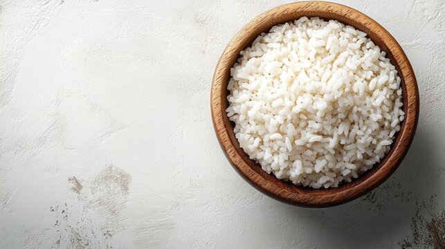 Wooden bowl filled with parboiled rice on a neutral background ideal for healthy food concepts and product promotion high resolution