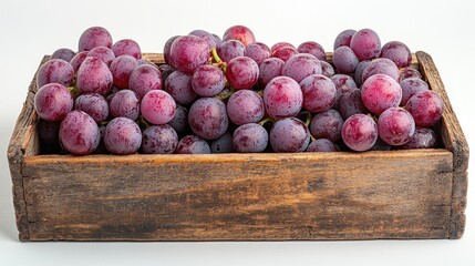 Fresh red grapes in a rustic wooden box on a clean white background showcasing vibrant colors and natural textures.