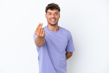 Young caucasian handsome man isolated on white background making money gesture