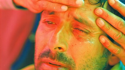 A closeup image portrays the Samaritans hands gently cradling the ed mans head. The background is blurred emphasizing the intimate connection between the two. The Samaritans. Cartoon