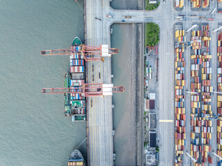 Cargo container port on seaside at sunrise