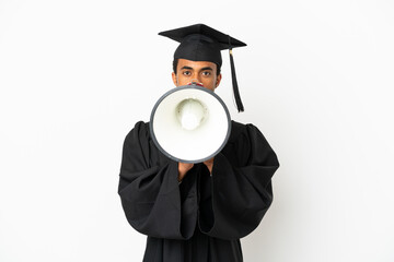 African American university graduate man over isolated white background shouting through a megaphone
