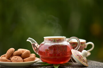 still life with teapot and cup of tea on table