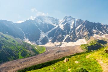 Picturesque view of the glacier seven with a tourist trail in sunny weather