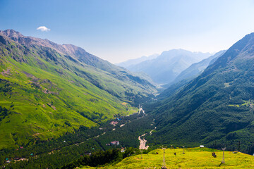 Obraz premium Beautiful picturesque view of a mountain gorge among green mountains in good weather