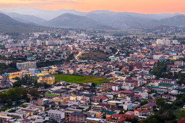 Beautiful evening view of Sudak city after sunset. Southern coast of Crimea peninsula. Russia