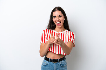 Young caucasian woman isolated on white background pointing to the front and smiling