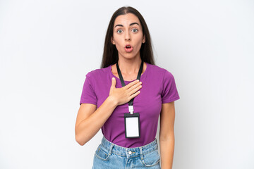 Young caucasian woman with ID card isolated on white background surprised and shocked while looking right