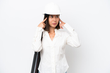 Young architect woman with helmet and holding blueprints isolated on white background having doubts and thinking