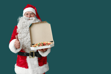 Santa Claus with box of tasty pizza showing thumb-up on green background