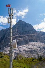 Obraz premium Mountain landscape and mast of cellular communication on the Grosse Scheidegg in the Swiss Alps