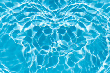 Blue water with ripples on the surface. Defocus blurred transparent blue colored clear calm water...