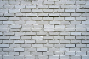 Naklejka premium texture of grey tile wall. Background of gray tiled wall. Rectangular tile. stone wall pattern, seamless texture. Texture of road granite tiles with white seams Stone backdrop building exterior