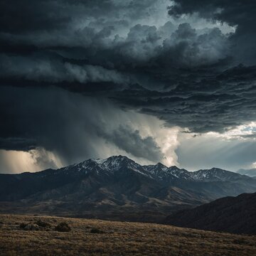 A dramatic storm rolling over a rugged mountain range.