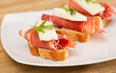 Perfect sandwich made with rye bread cheese and Parma ham
