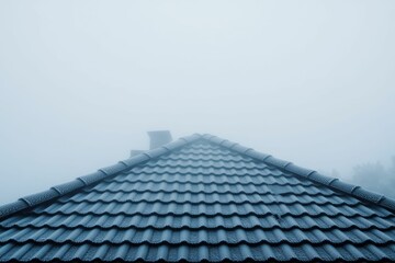 Obraz premium Frosty roof peak, foggy sky, winter scene.