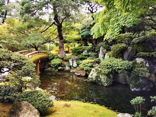 Naklejka premium japanese garden with stone and bridge 