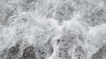 Much sand and meershaum in the sea, river, lake, ocean water. Nature background.
