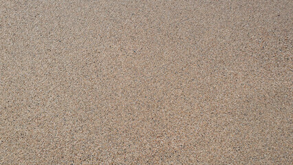 Beautiful sand in the summer day. Sand on the beach near a sea.