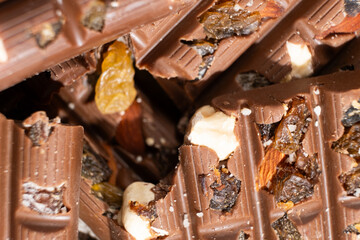 Close-up of milk nut chocolate. Healthy sweets, lactose-free and sugar-free chocolate