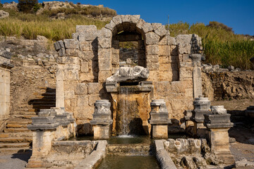 Rows of columns in Perge, Antalya, Turkey. Remains of colonnaded street in Pamphylian ancient city.Rows of columns in Perge, Antalya, Turkey. Ancient Kestros Fountain. Aksu, Antalya