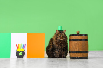 Cute cat in leprechaun hat with barrel of beer and Irish flag for St. Patrick's Day celebration...