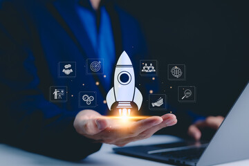 Businessman holding icons business growth and investment, Rocketing take off with a targeted launch...