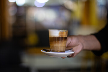 An inviting macchiato with smooth milk foam, perfect for cozy moments.