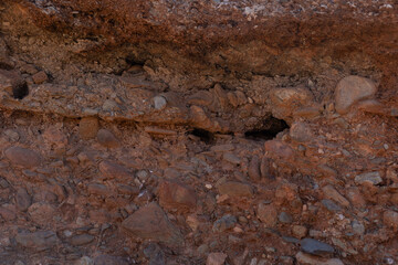 Detailed view of rugged sedimentary formations in a desert area south of Marrakech, Morocco.