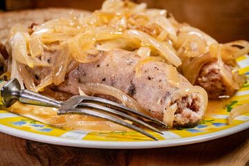 White sausage with stewed onion.