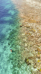 Snorkeler Exploring Coral Reef