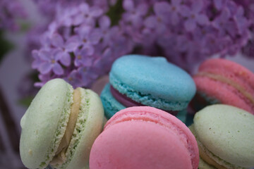 Close-up of colorful macarons with lilac background