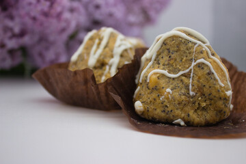 Close-up of homemade poppy seed pastry with icing drizzle