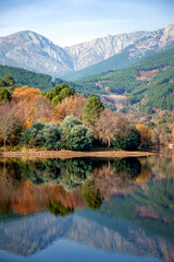 Beautiful autumn vertical view of the Sierra de Gredos from the Riocuevas reservoir in Arenas de San Pedro, Ávila, Castilla y León, Spain