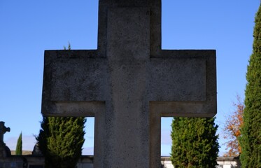 Cross made of marble in a cemetery