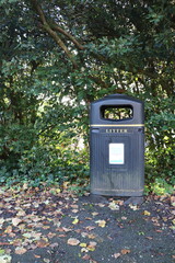 Litter Bin in a Park with Greenery Background