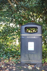 Litter Bin in a Park with Greenery Background