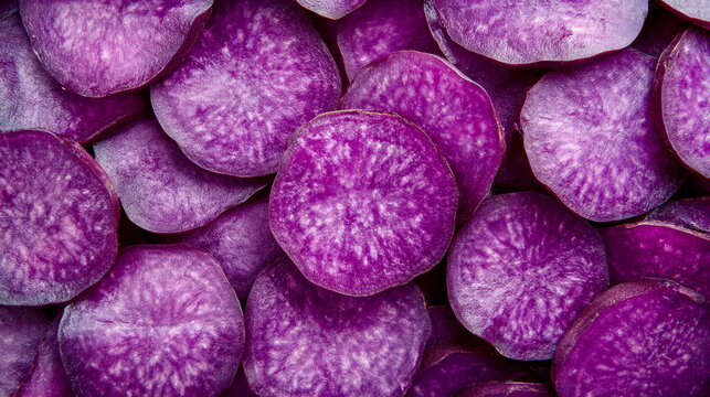 Detailed shot of vivid purple ube yam slices with their rich color contrasting against a clean background