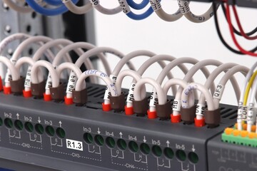 Connection of electrical modules using insulated mounting wires. Close-up. Soft focus.