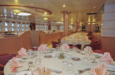 Formal and elegant ocean view dining room restaurant onboard historic luxury cruiseship or cruise...