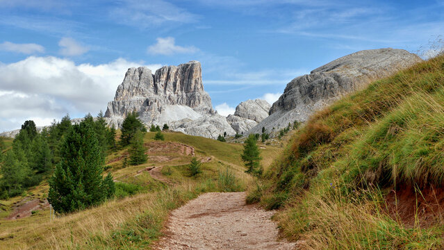 Footpath to the mountains in the Italian Dolomites autumn landscape
