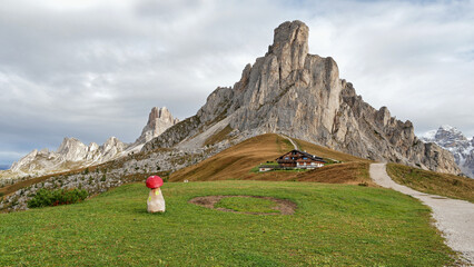 Autumn mountains with hut in Italian Dolomites autumn landscape