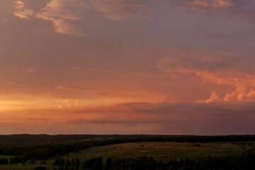 Dusk envelops Sviyazhsk with a vivid sunset that creates a captivating display across the peaceful horizon.