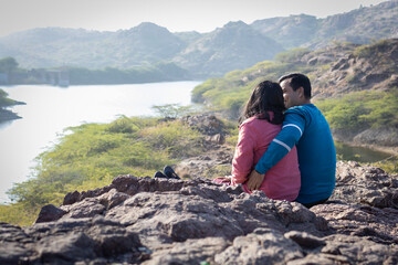 Couple spending quality time and Embracing Mountain Serenity with Lake View