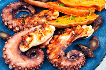 Grilled octopus with potato.