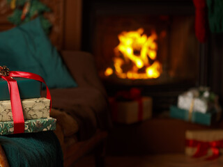 Obraz premium Atmospheric living room decorated for Christmas. Christmas tree with gifts and fireplace in the living room. New Year's interior with fireplace. Christmas eve at home